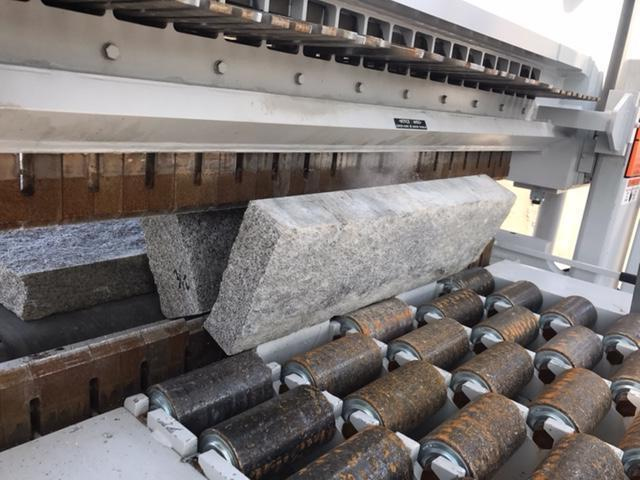 Olde New England Granite is now machine splitting our reclaimed Rockport granite material into wonderful wall building/veneer material.