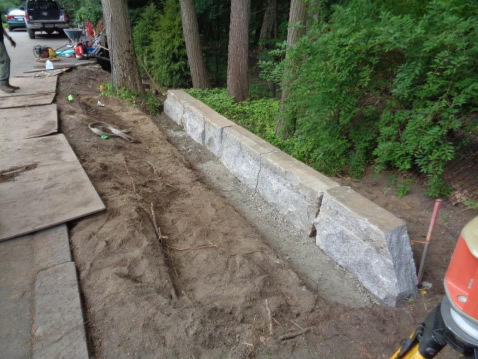 In two hours the retaining wall was completed then backfilled. 